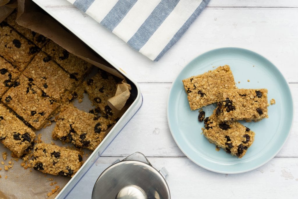 Flapjacks on a plate and in a biscuit tin