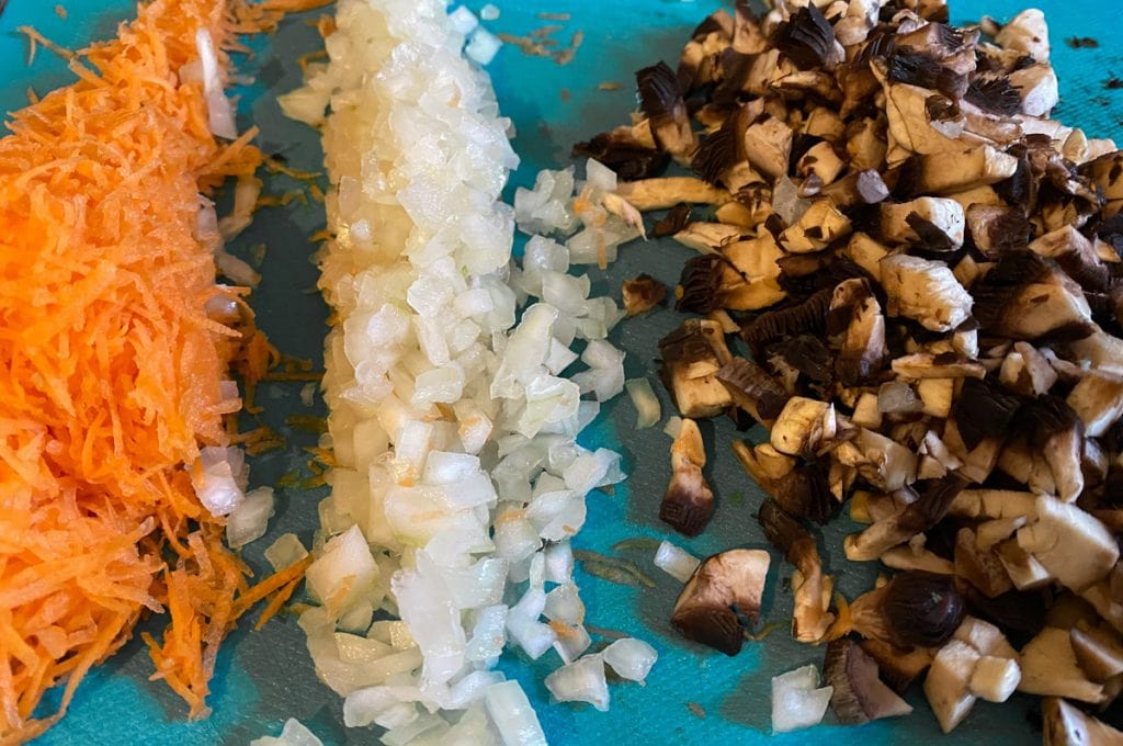Chopped carrot, onion, and mushroom ready for vegetarian haggis recipe